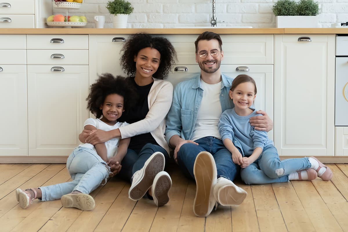 Happy family sitting in kitchen